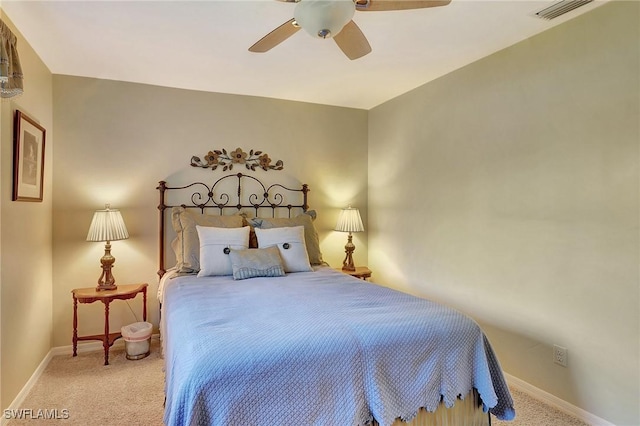 bedroom with light colored carpet, visible vents, and baseboards