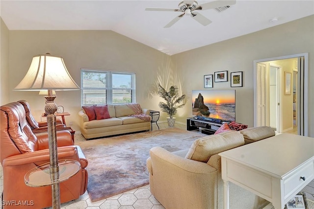 living room featuring a ceiling fan, lofted ceiling, and visible vents