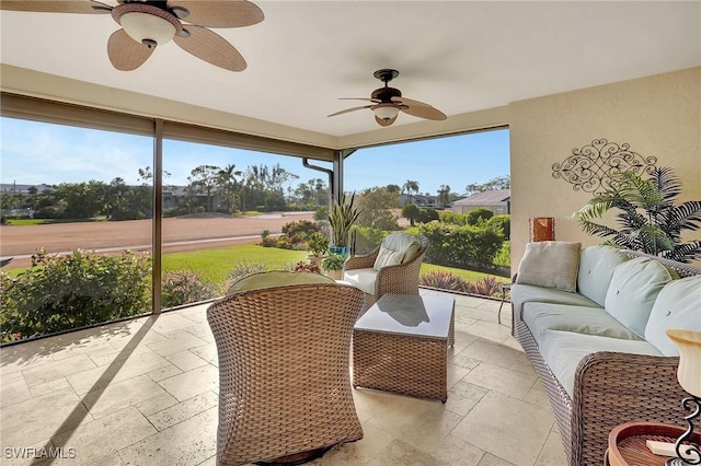 view of patio with outdoor lounge area and ceiling fan