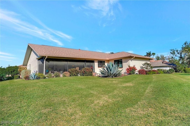 exterior space featuring a yard and stucco siding