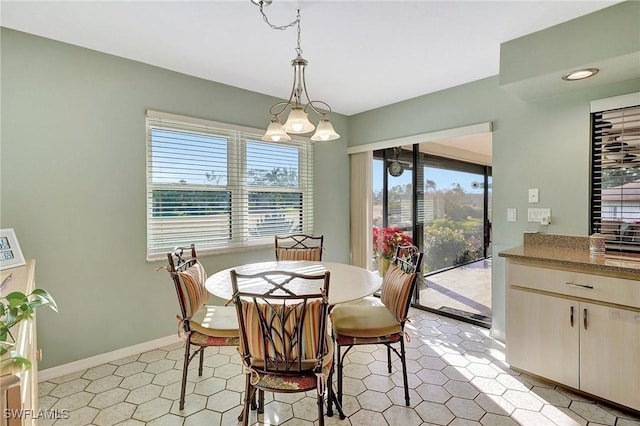 dining area featuring baseboards