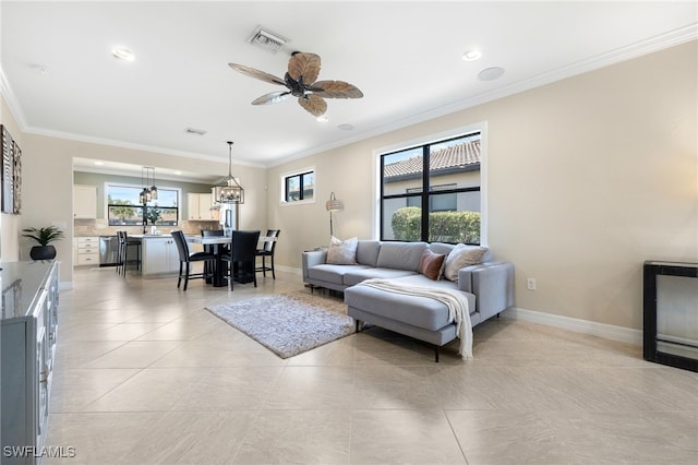 tiled living room with crown molding and ceiling fan