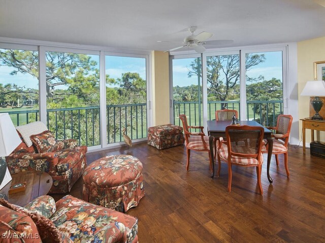 sunroom / solarium featuring ceiling fan