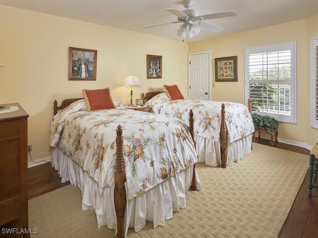 bedroom featuring hardwood / wood-style flooring and ceiling fan