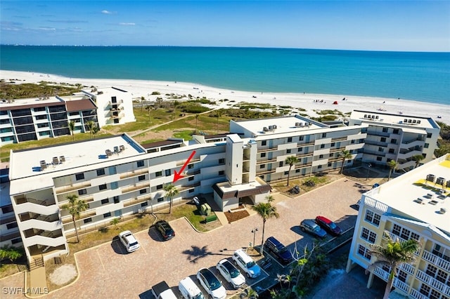 aerial view featuring a beach view and a water view