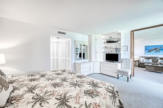 bedroom featuring light colored carpet