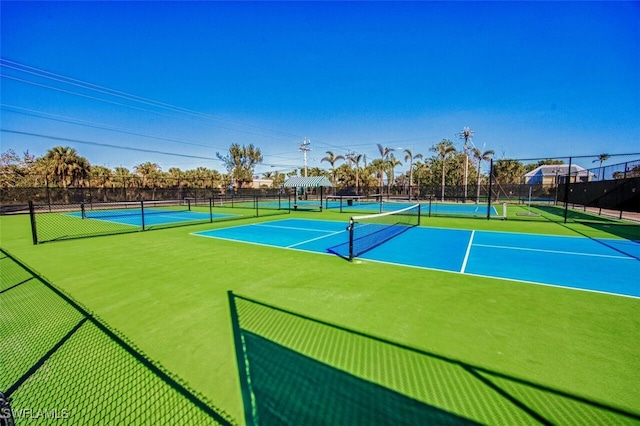 view of tennis court featuring basketball court