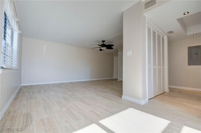 interior space with electric panel and ceiling fan