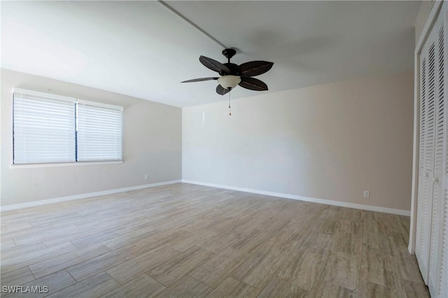 empty room featuring light hardwood / wood-style floors and ceiling fan