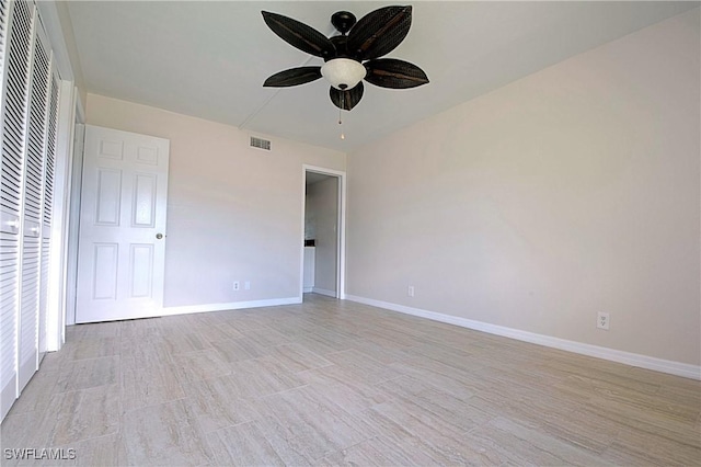 unfurnished bedroom featuring ceiling fan