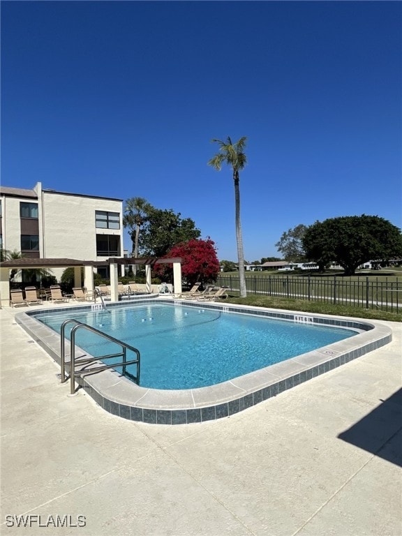 view of swimming pool featuring a patio