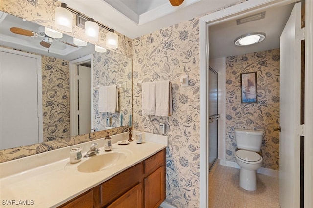 3943 SE 11th Pl Unit 105, Cape Coral, FL 33904 - bathroom featuring vanity, ceiling fan, toilet, a shower with door, and tile patterned floors