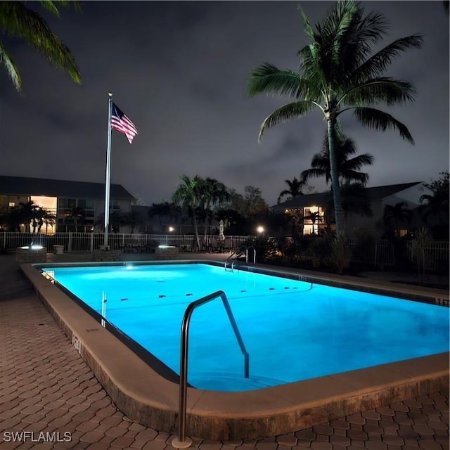 view of pool at night