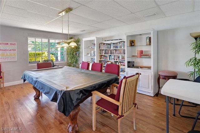 recreation room featuring a paneled ceiling, pool table, and light hardwood / wood-style flooring