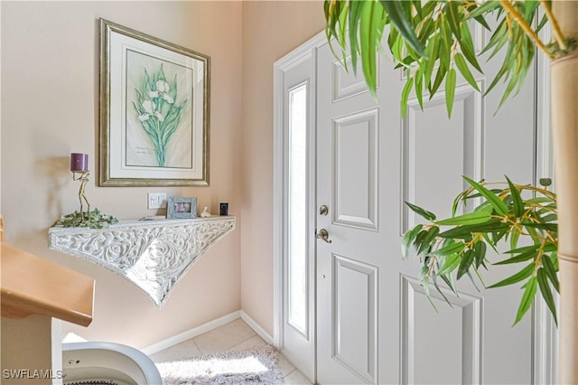 entryway with light tile patterned floors