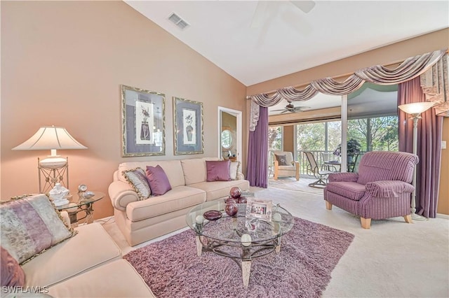 carpeted living room with lofted ceiling and ceiling fan