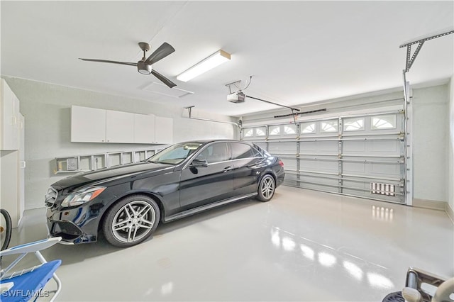 garage with a garage door opener and ceiling fan