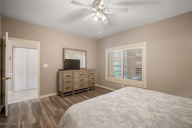 bedroom featuring wood-type flooring and ceiling fan