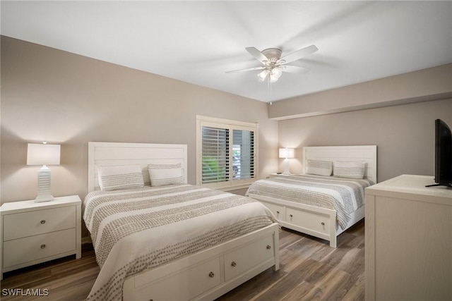 bedroom with dark wood-type flooring and ceiling fan