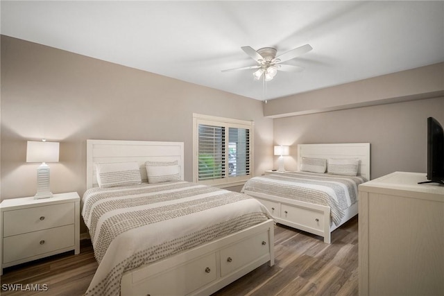 bedroom featuring dark wood-style floors and a ceiling fan