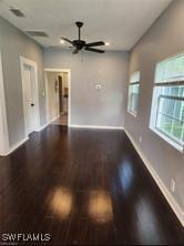 interior space with hardwood / wood-style floors and ceiling fan