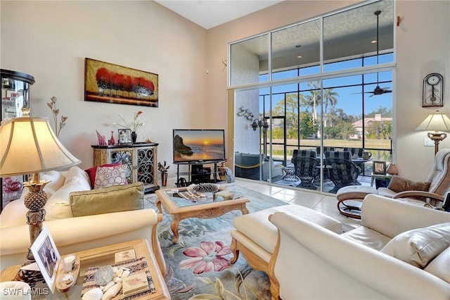 tiled living room with a towering ceiling