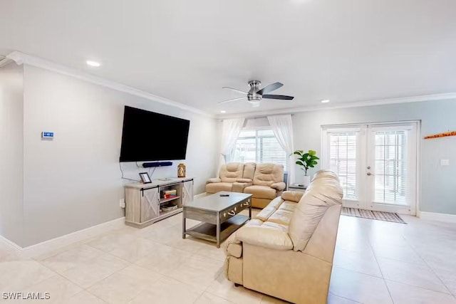 living room featuring light tile patterned floors, ornamental molding, french doors, and ceiling fan