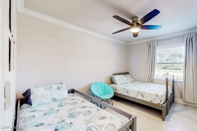 tiled bedroom featuring ornamental molding and ceiling fan