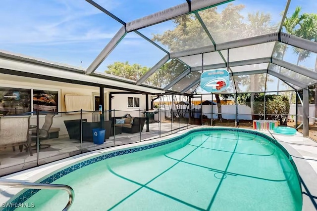 view of pool with a lanai and a patio