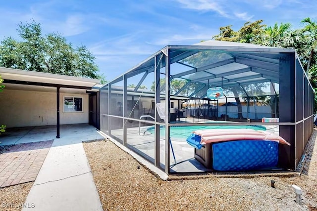 view of pool featuring a lanai and a patio area