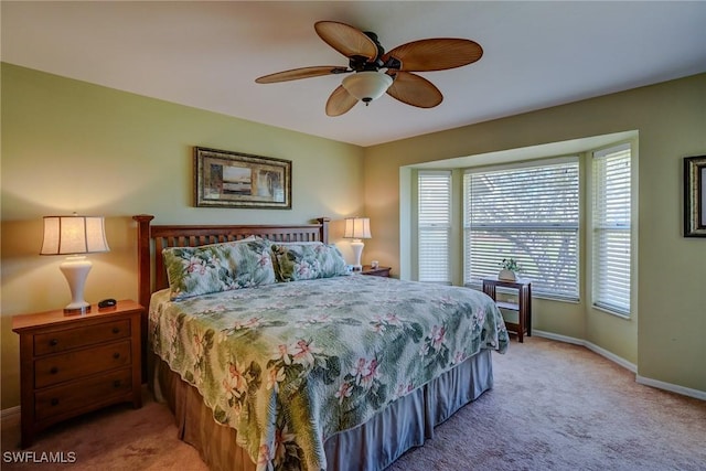 bedroom featuring ceiling fan and carpet