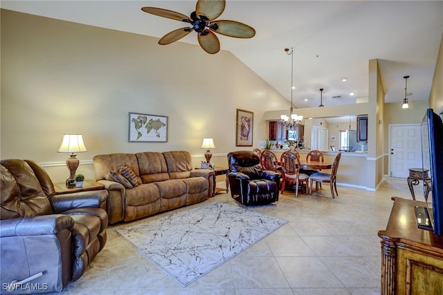 tiled living room featuring ceiling fan with notable chandelier and high vaulted ceiling