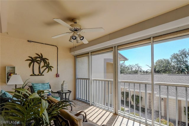 sunroom / solarium with ceiling fan