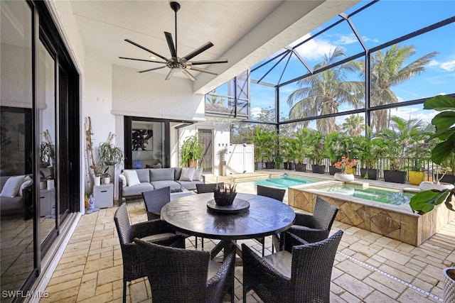 view of patio / terrace with a swimming pool with hot tub, an outdoor hangout area, and glass enclosure