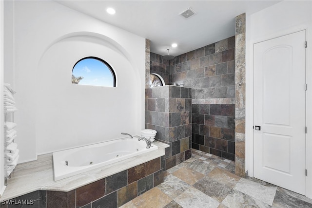 bathroom with shower with separate bathtub