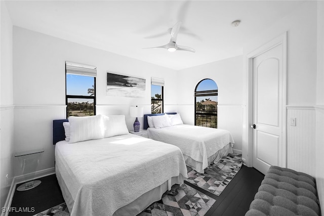 bedroom with hardwood / wood-style floors and ceiling fan