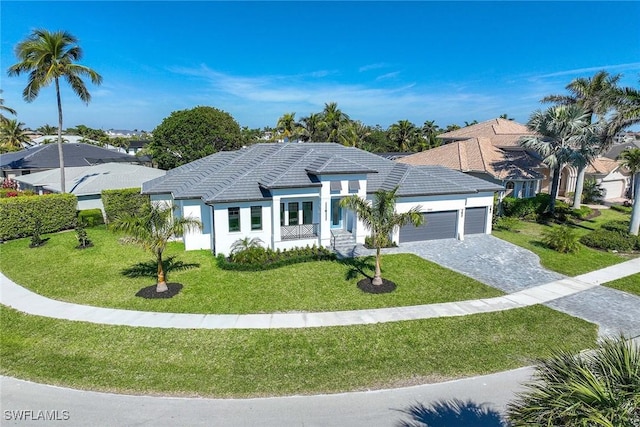 ranch-style house featuring a garage and a front yard