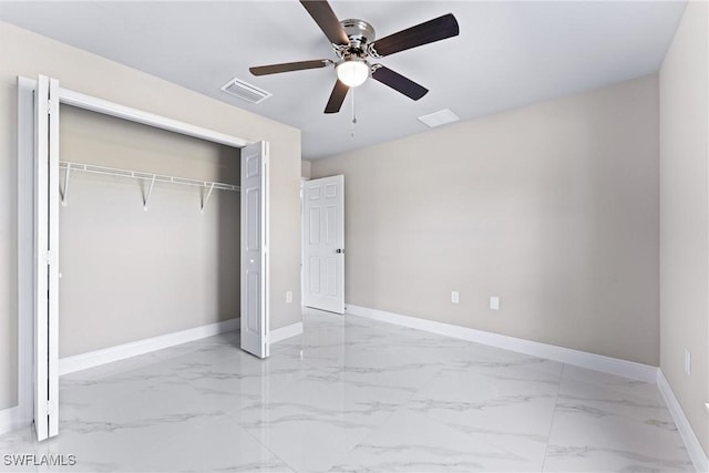 unfurnished bedroom featuring ceiling fan and a closet