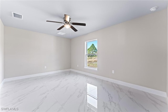 unfurnished room with ceiling fan