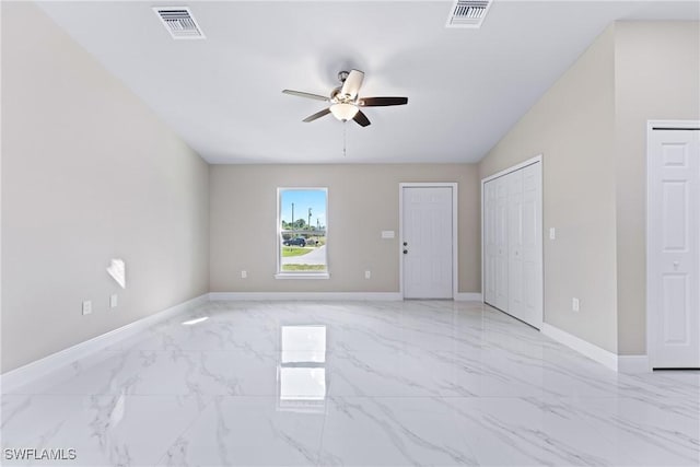 empty room with ceiling fan and lofted ceiling