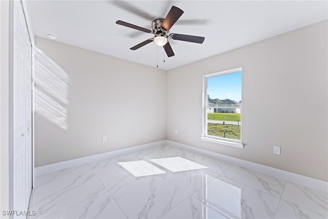 spare room with ceiling fan