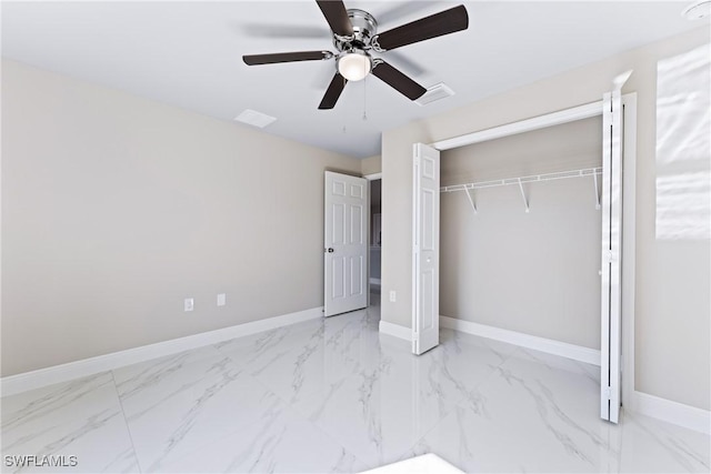 unfurnished bedroom with ceiling fan and a closet