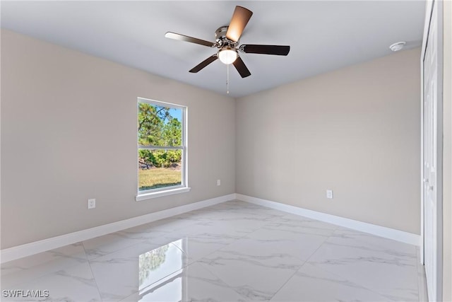 unfurnished room featuring ceiling fan