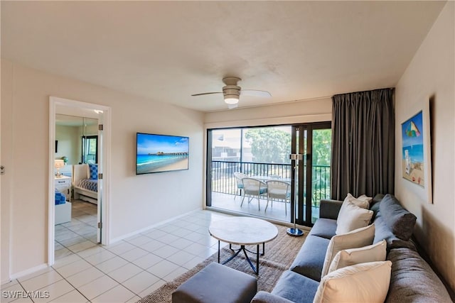 tiled living room with ceiling fan