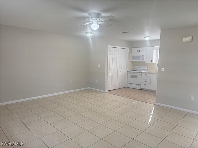 interior space with tasteful backsplash, white cabinets, light tile patterned floors, ceiling fan, and white appliances