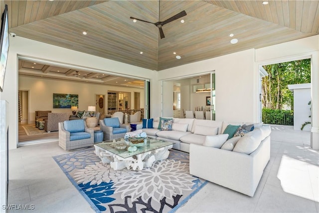 565 Anchor Rode Dr, Naples, FL 34103 - tiled living area with a tray ceiling, wood ceiling, ceiling fan, and recessed lighting