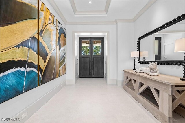 565 Anchor Rode Dr, Naples, FL 34103 - entryway with a tray ceiling, crown molding, french doors, and baseboards
