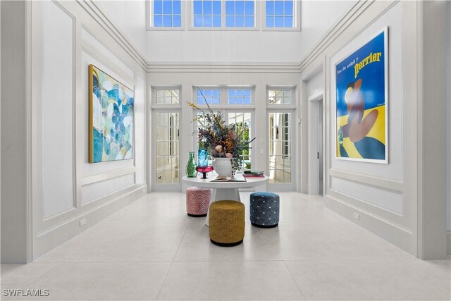 565 Anchor Rode Dr, Naples, FL 34103 - interior space featuring a decorative wall and french doors