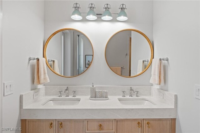 565 Anchor Rode Dr, Naples, FL 34103 - bathroom featuring a sink and double vanity