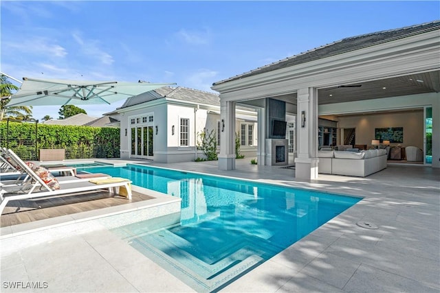 565 Anchor Rode Dr, Naples, FL 34103 - view of swimming pool with a patio area, an outdoor structure, a fenced in pool, and a storage structure